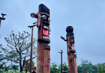 A close-up of a traditional male and female Korean totem pole at the Northern Sky Skyway in Seoul,...