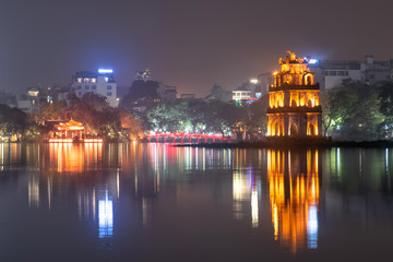 Fototapeta na wymiar Hanoi Hoan Kiem Lake and Turtle Tower in the center of Hanoi, the capital city of Vietnam also know as Lake of the Returned Sword in historical of Vietnam