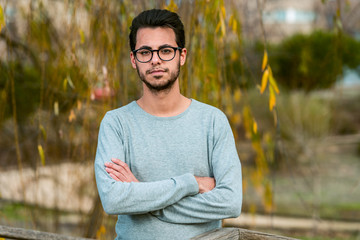 Young student of computer science poses at the campus park near the Polytechnic School