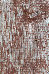 Old wooden background with remains of pieces of scraps of old paint on wood. Texture of an old tree, board with paint, vintage background peeling paint. old blue board with cracked paint
