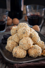Snack cheese balls with prunes and walnuts, selective focus