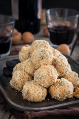 Snack cheese balls with prunes and walnuts, selective focus