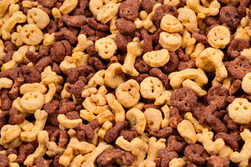  Chocolate flakes in the form of skulls and bones background. Top view.