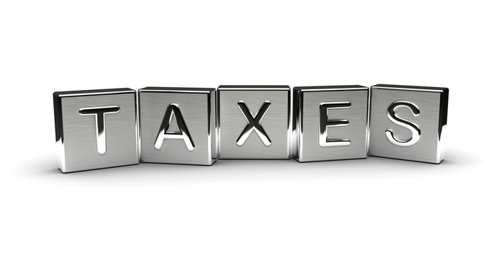 Taxes Text on Metal Block
