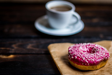 Pink donut with white sprinkle