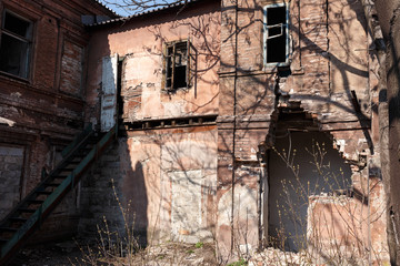 Fototapeta na wymiar Ruin. Residential building destroyed by time