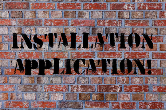 Text sign showing Installation Application. Business photo text setup of computer program including device drivers Brick Wall art like Graffiti motivational call written on the wall - Powered by Adobe