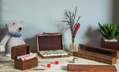 display table with traditionall games, cribbage, cards, dominos and dice