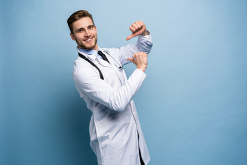 Surgeon doctor man proud and self-satisfied in love yourself concept isolated on light blue.