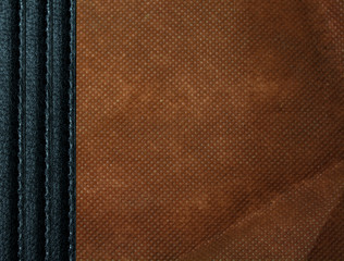 Leather background with fabric texture in natural brown