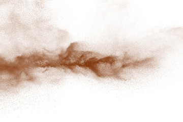 Fototapeta na wymiar Explosion of deep brown powder on white background.