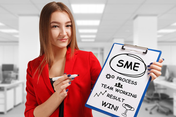Business, technology, internet and networking concept. Young entrepreneur showing keyword: SME