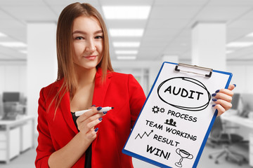 Business, technology, internet and networking concept. Young entrepreneur showing keyword: Audit