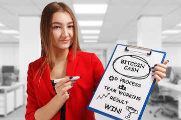 Business, technology, internet and networking concept. Young entrepreneur showing keyword: Bitcoin...