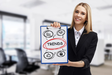 Business, technology, internet and networking concept. Young entrepreneur showing keyword: Trends
