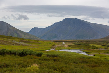 All-terrain vehicle rides on the road in the tundra, Yamal, Russia