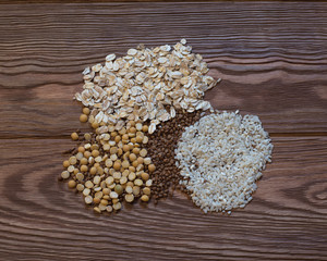 Obraz na płótnie Canvas cereals on a background of a wooden texture