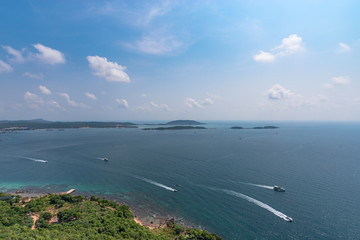 Seascape with tropical islands and boats. View from above.