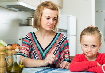 Upset mother shaming daughter