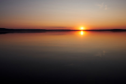 Sunset on the lake without waves © Eduard Vladimirovich
