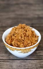 Rousong or beef floss on wood background.