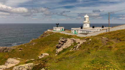 Pendeen Lighthouse at the coast near Panzance in Cornwall, UK