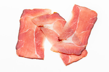 Hamon sliced on white background. Spanisch traditional meat.