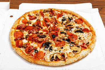 Closeup pizza with pepperoni and mushrooms