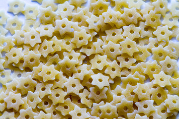 Closeup background made of raw  stars macaroni