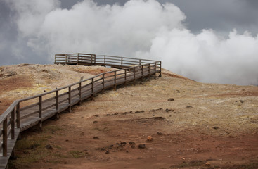 Iceland geothermal zone Namafjall - area in field of Hverir. Landscape which pools of boiling mud and hot springs. Tourist and natural attractions.