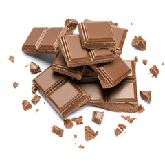 Milk organic chocolate pieces isolated on white background