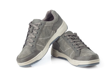 Gray sneakers isolated on white background.
