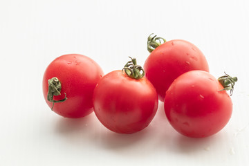  Close up tomatoes on isolate white background.Selective focus red tomatoes.