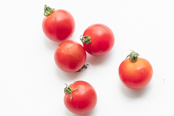 Close up tomatoes on isolate white background.Selective focus red tomatoes.