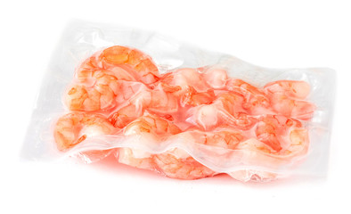 Frozen  shrimps in a vacuum package  isolated on white background .