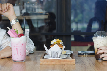 Coffee time,Pink milk and cake on the table