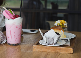 Coffee time,Pink milk and cake on the table
