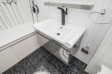 The photo of a sink in a bathroom