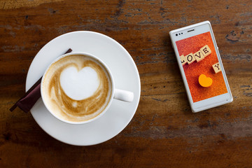 cup of coffee on wooden table