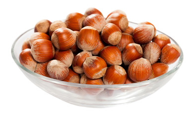Glass bowl with hazelnuts