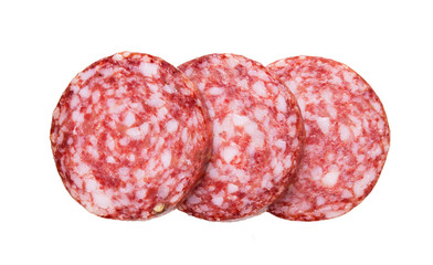 Top view of sliced sausage salami isolated on white background.