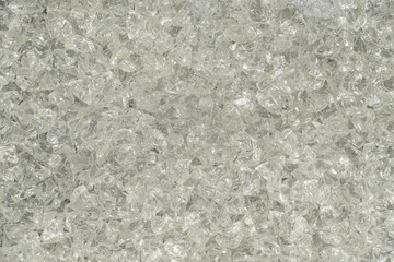 Wall of broken and polished pieces of glass as background