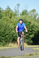 Obraz premium Athlete Male Cyclist And Happiness Biking