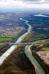 colorful view from above two big rivers an a motorway surroundes by a city and nature