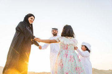 Arabian family in the desert