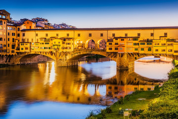 Florence, Italy. Ponte Vecchio bridge over Arno river at twilight.