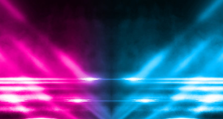 Empty background scene. Dark street, a reflection of blue and pink neon light on wet pavement. Rays of light in the dark, smoke. Night view of the street, the city. Abstract dark background.