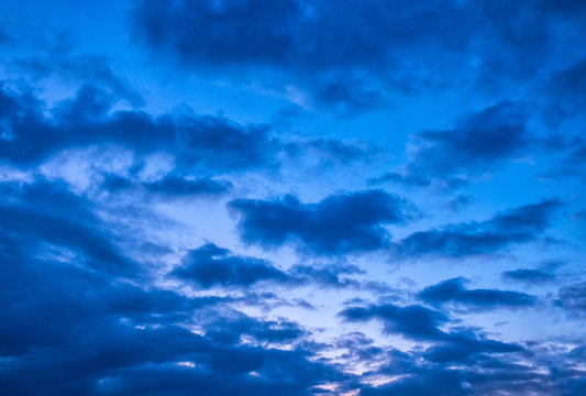 dramatic cloudy sunset sky blue hour background