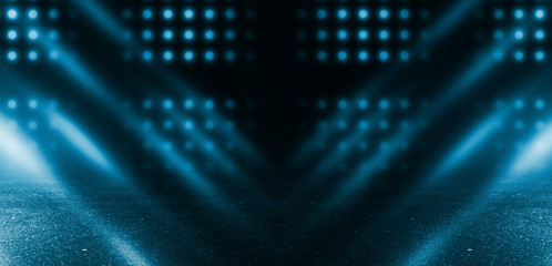 Obraz premium Empty scene background. Dark street, reflection of neon light on wet asphalt. Rays of light in the dark, smoke. Night view of the street, the city. Abstract dark blue background.