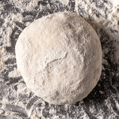 dough with flour on a black background